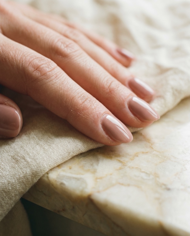 Close-up of a soft neutral manicure